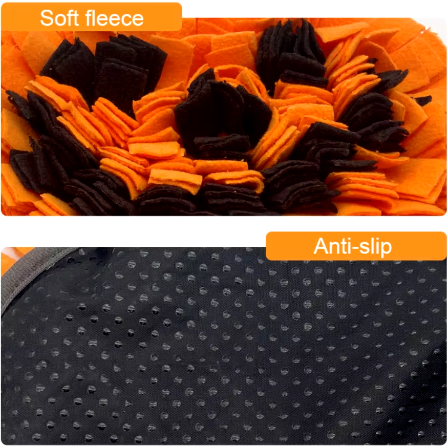 Dog sniffing a Halloween-themed pumpkin snuffle mat for hidden treats.