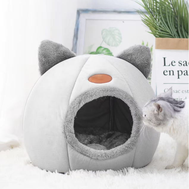 Deep sleep comfort cat bed in cave design, made with soft plush material and non-slip base for warm, cozy winter sleep.