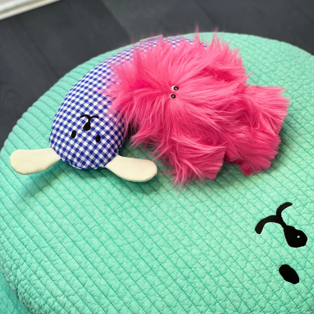 U-shaped cotton pet pillow for cats and dogs with removable washable cover, ideal for chin support and deep sleep.