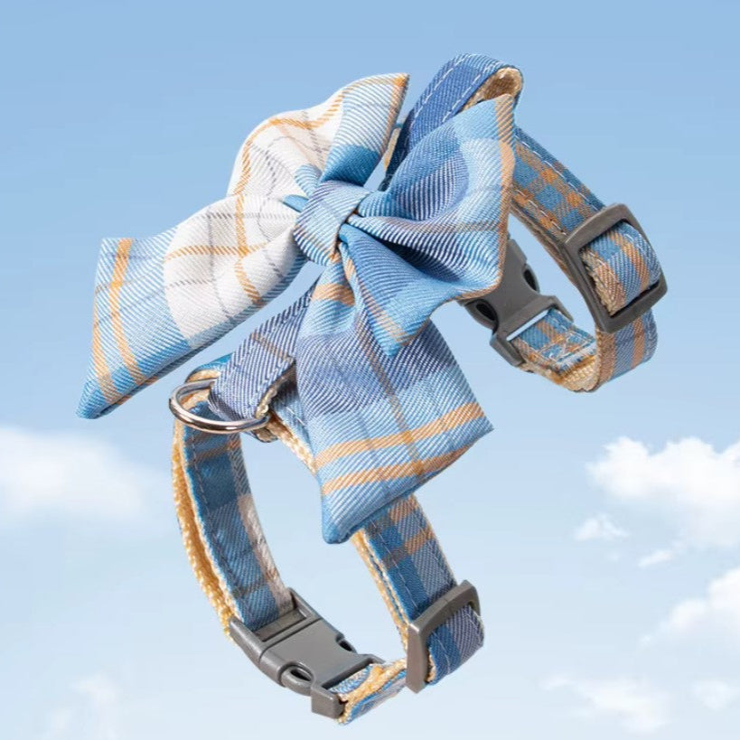 Pet harness with breast strap featuring a stylish blue plaid design and bow, perfect for comfortable and secure pet wear.