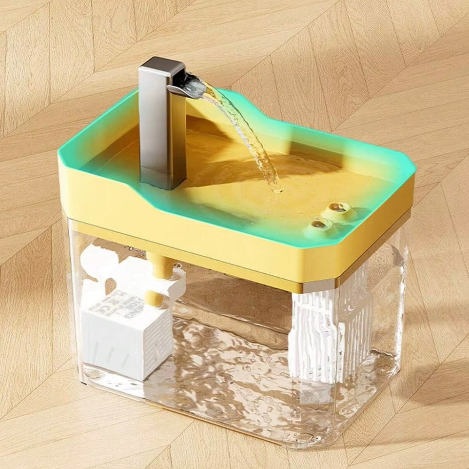 Transparent automatic cat water fountain with USB pump and recirculating filter system.