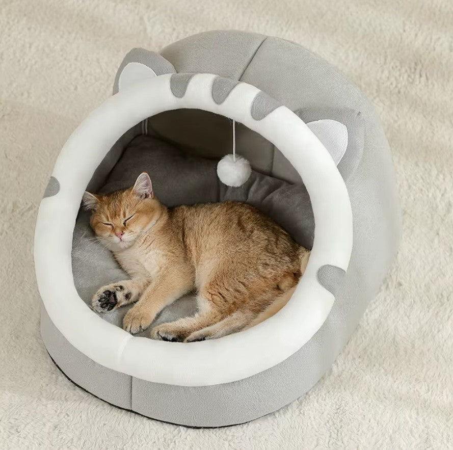 Cozy cat sleeping in a super cat bed with plush cushion and semi-enclosed design for comfort.