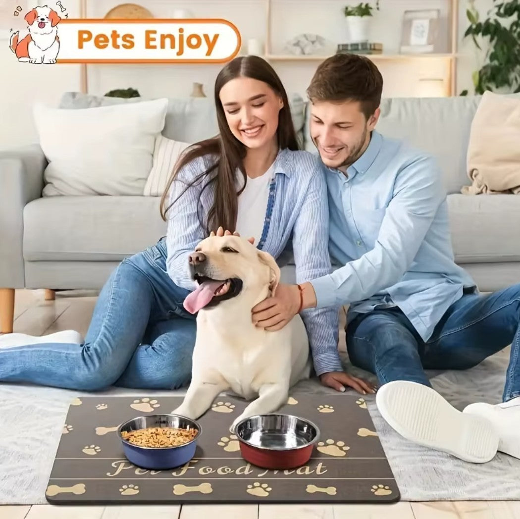 Couple enjoying time with their dog on a pet feeding mat that features food and water bowls.