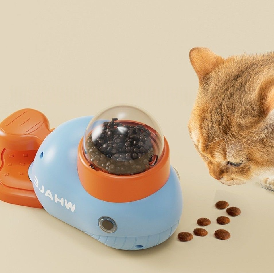 Interactive feeder for cats and dogs, featuring a playful design with a duck-shaped dispenser and snacks.