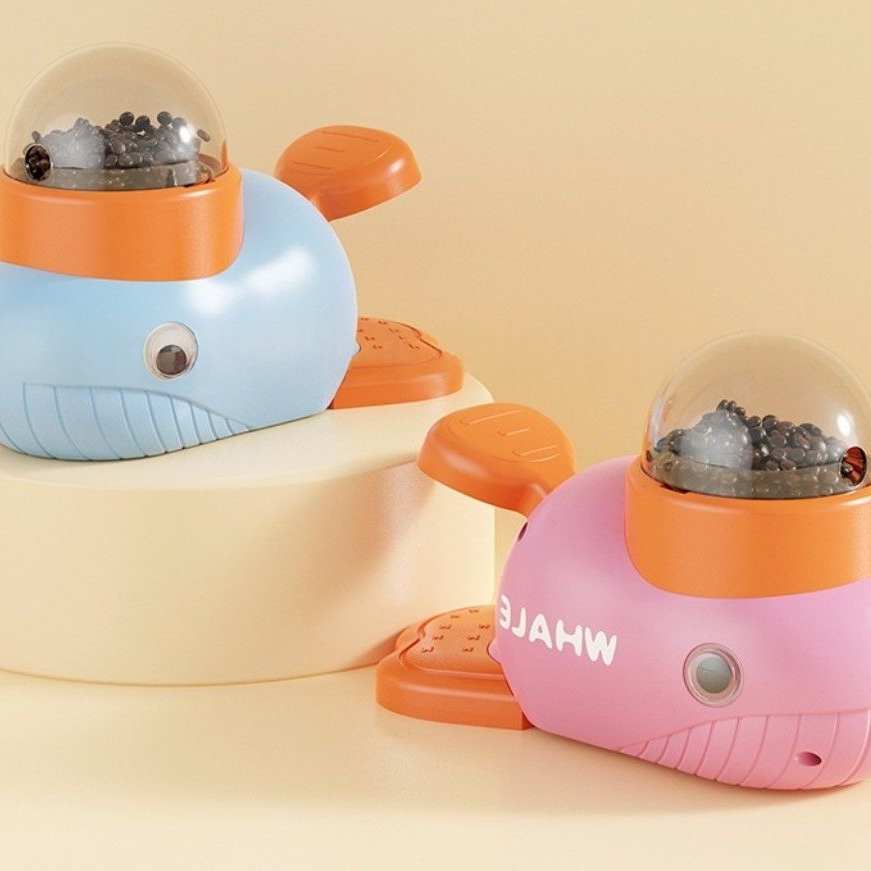 Interactive feeder shaped like whales with colorful design for engaging pet feeding.