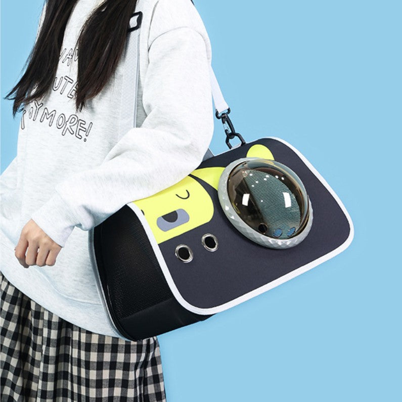 Stylish AstroView™ pet travel bag being carried, designed for comfortable pet travel.