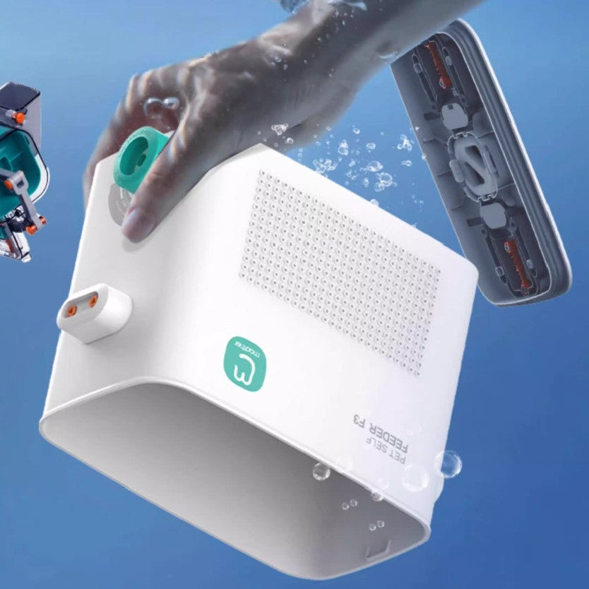 Image of a modern pet feeding station submerged in water, demonstrating its waterproof design and innovative features.
