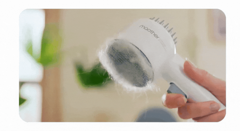 Pet grooming brush removing loose fur from a pet, showcasing the Artisan™ Dual-Sided design for effective grooming.