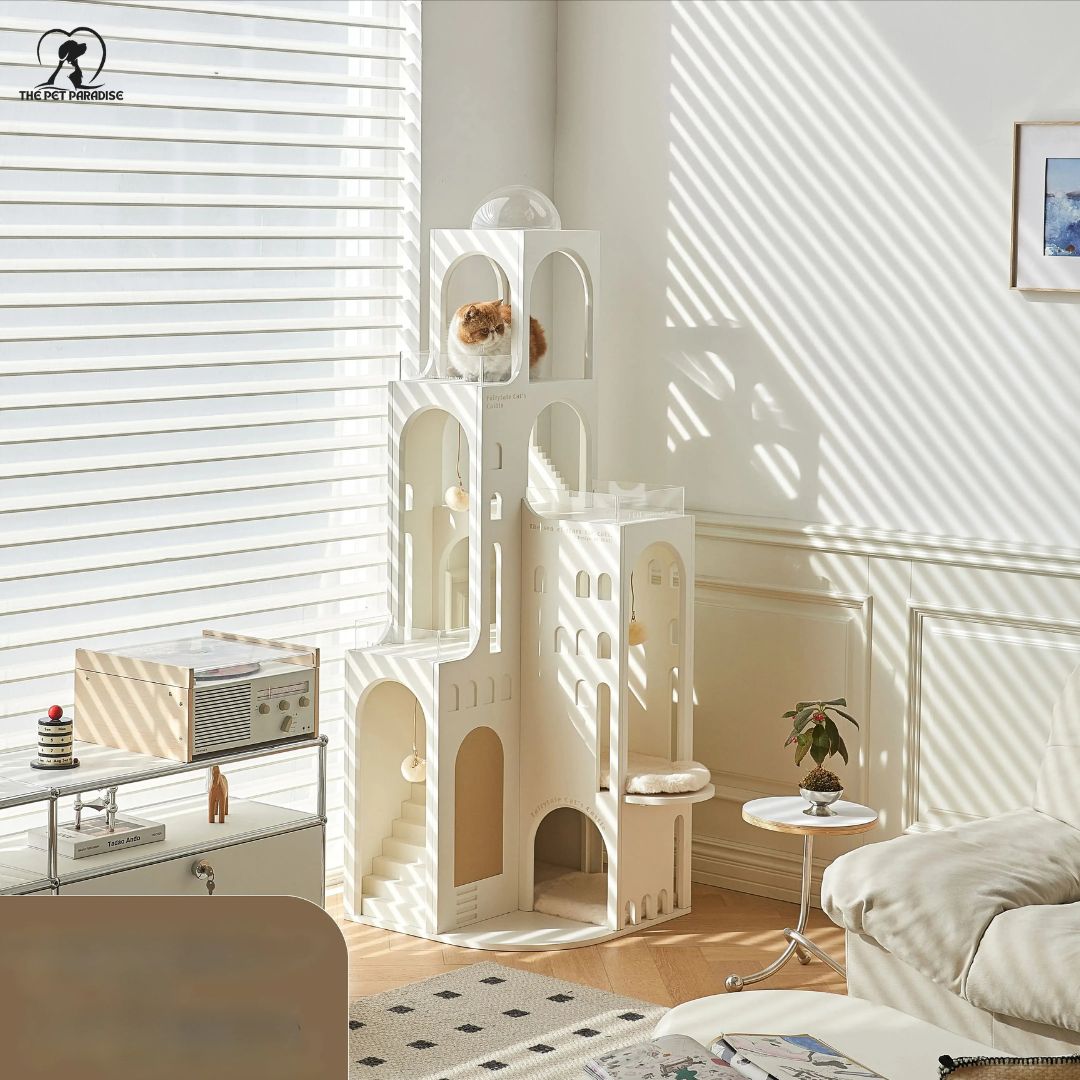 Elegant white cat castle with cozy compartments and a playful cat inside, enhancing home décor.