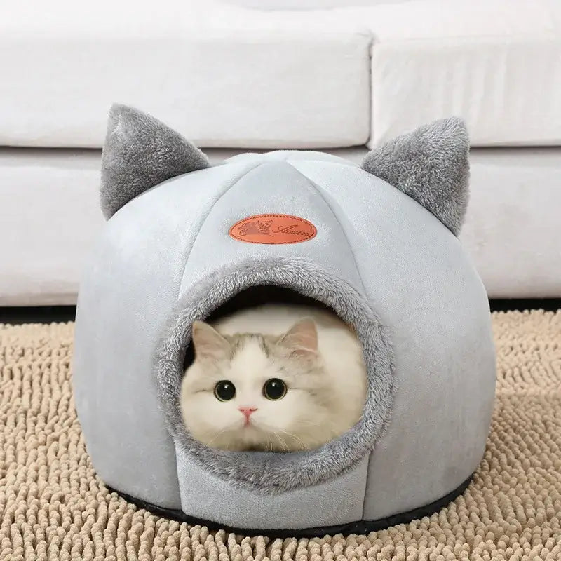 Deep sleep comfort cat bed in cave design, made with soft plush material and non-slip base for warm, cozy winter sleep.