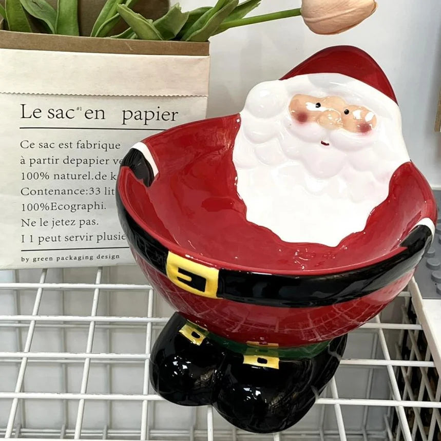 Santa Claus ceramic pet bowl for cats and dogs, featuring festive 3D design and elevated structure.