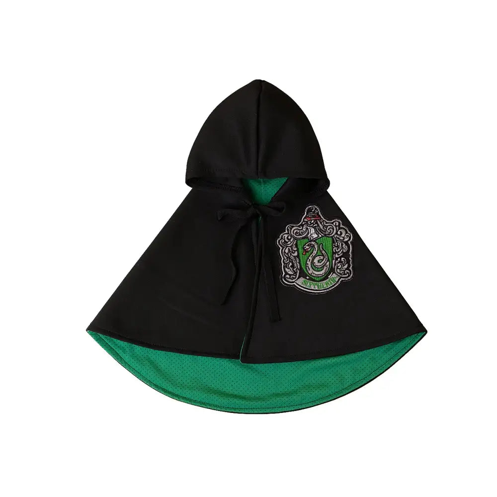 Cat or small dog wearing a shiny satin cape with magical Halloween theme.