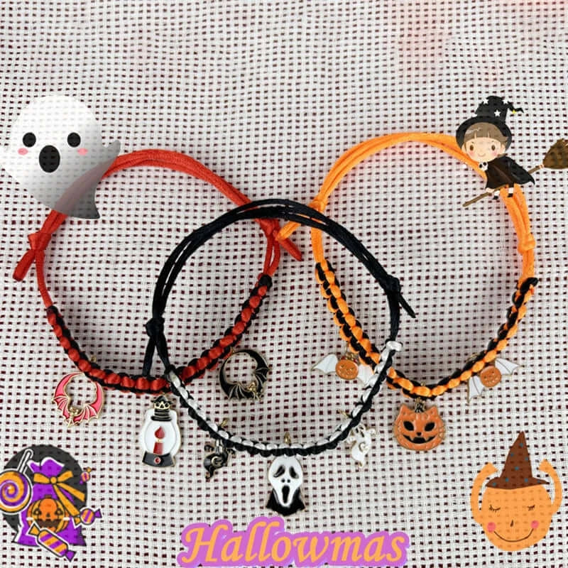 Cat wearing a Halloween breakaway collar with a small pumpkin pendant and festive woven design.