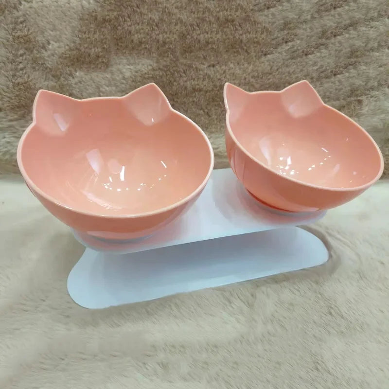 Non slip pet bowl set with elevated design for cats and dogs, featuring dual cat-shaped bowls in a stylish pink color.