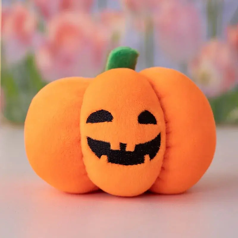 Small dog cuddling a Halloween pumpkin plush toy with night light.
