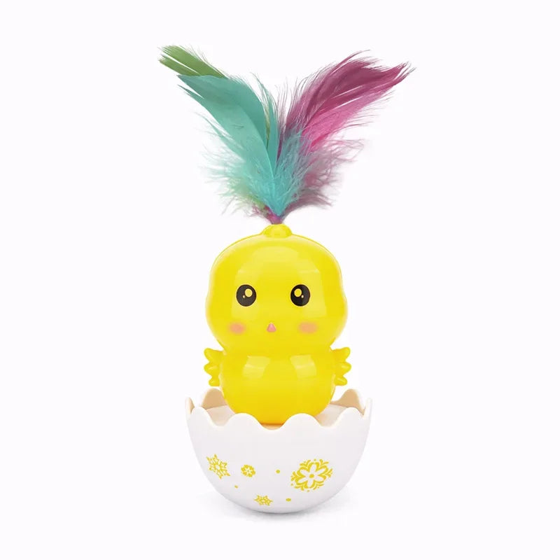 Bright yellow tumbler cat toy with colorful feathers in an egg-shaped base, engaging design for feline play.