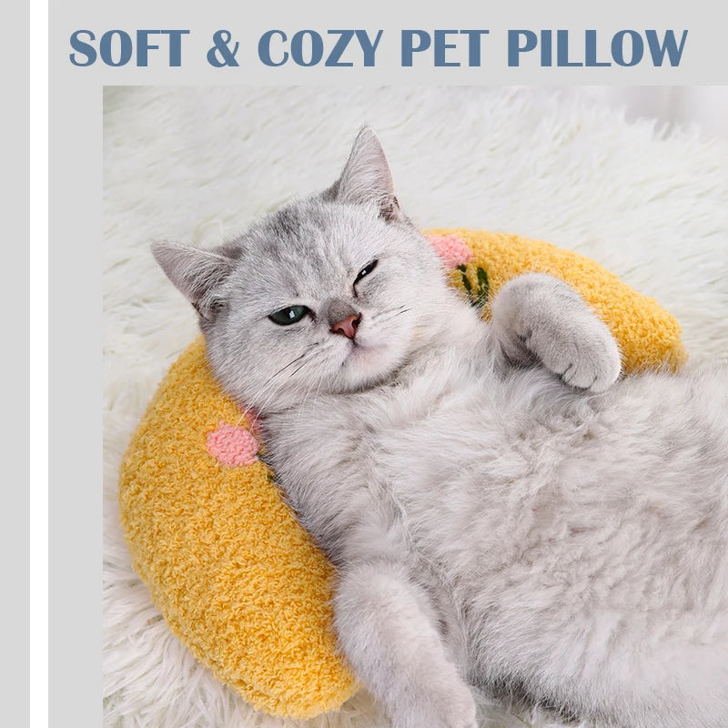 Cat resting on small U-shaped pet pillow in soft plush fabric
