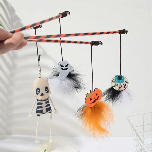 Halloween-themed cat teaser wand with pumpkin, ghost, feathers, and bell.