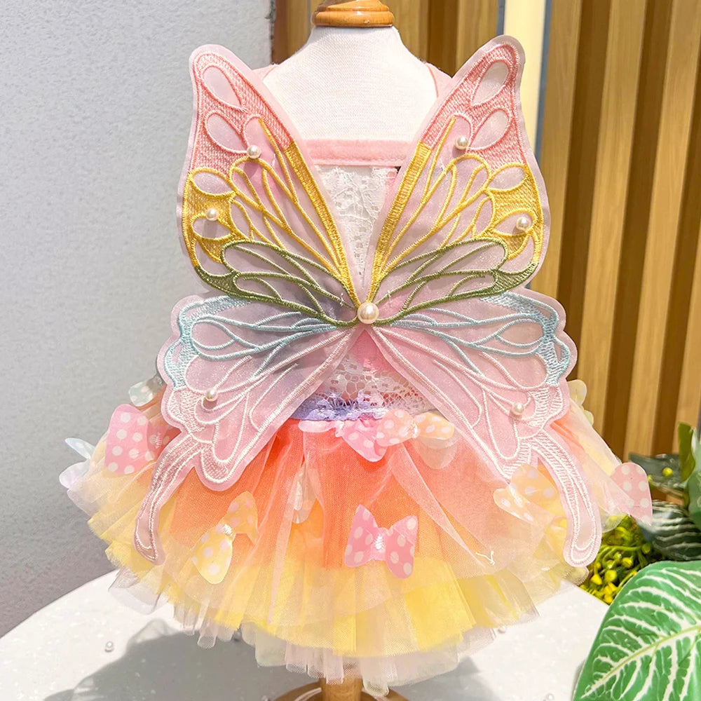 Small dog wearing the Butterfly Princess Dress, showcasing a charming and stylish design perfect for special occasions.