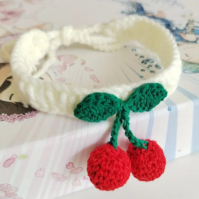 Handmade knitted pet collar with cherry decoration for cats