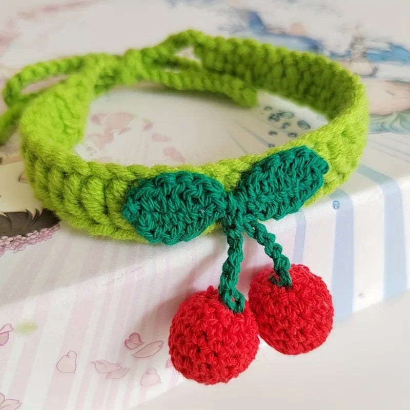 Handmade knitted pet collar with cherry decoration for cats
