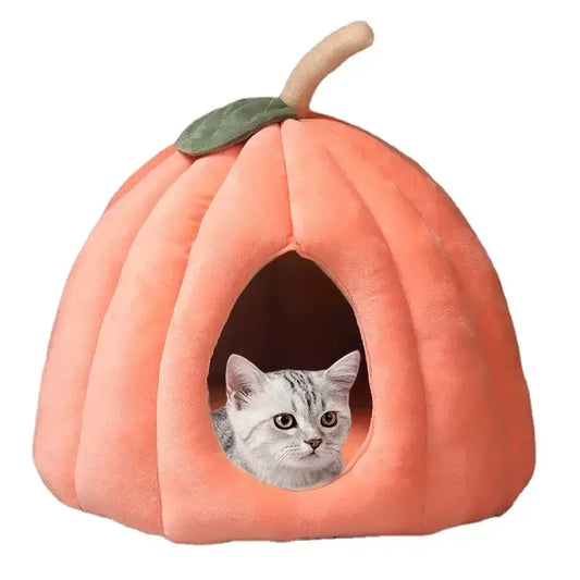 Pumpkin-shaped enclosed cat bed for winter warmth and Halloween decor.