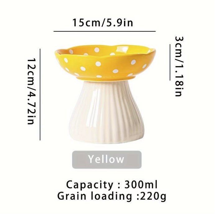 Ceramic cat feeder with mushroom elevated shelf, yellow with white polka dots, 300ml capacity.