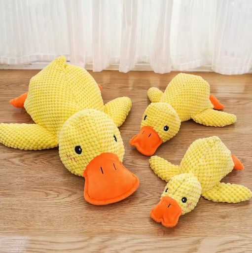 Calming pet toy collection featuring three durable plush duck toys in vibrant yellow for dogs and cats.