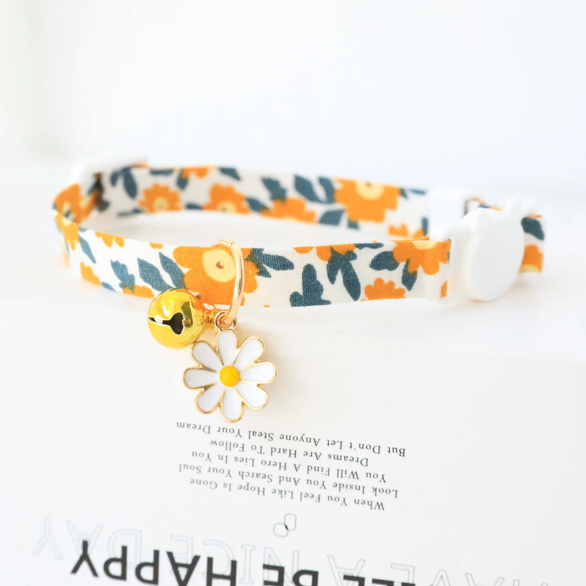 Reflective plaid cat collar with bow and daisy charm for small pets