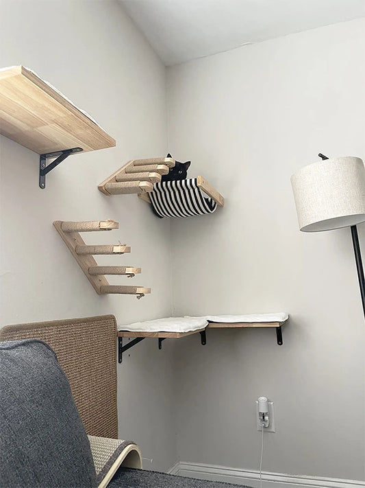 Wall-mounted cat shelf with sisal scratching posts and multi-level steps
