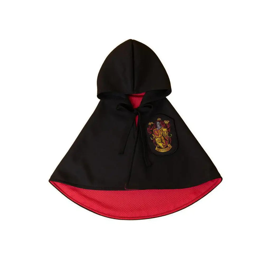 Cat or small dog wearing a shiny satin cape with magical Halloween theme.