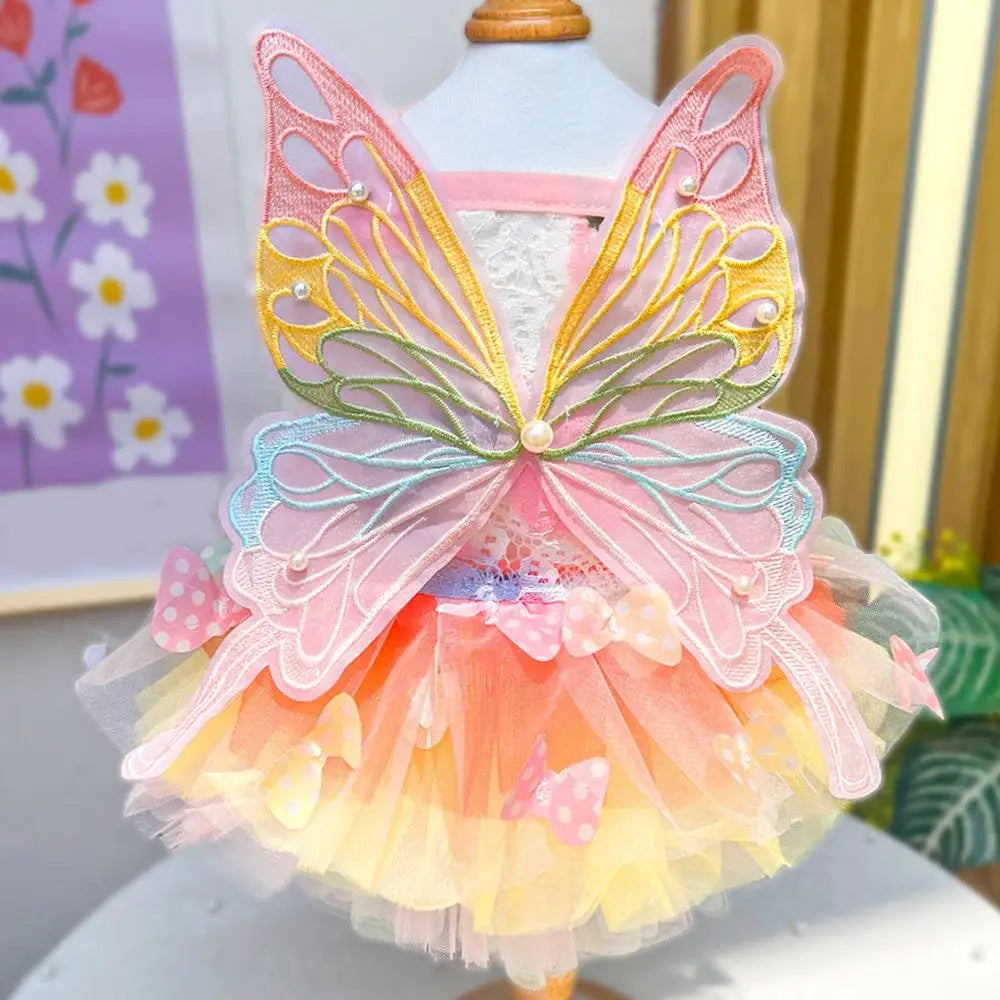Small dog wearing the Butterfly Princess Dress, showcasing a charming and stylish design perfect for special occasions.