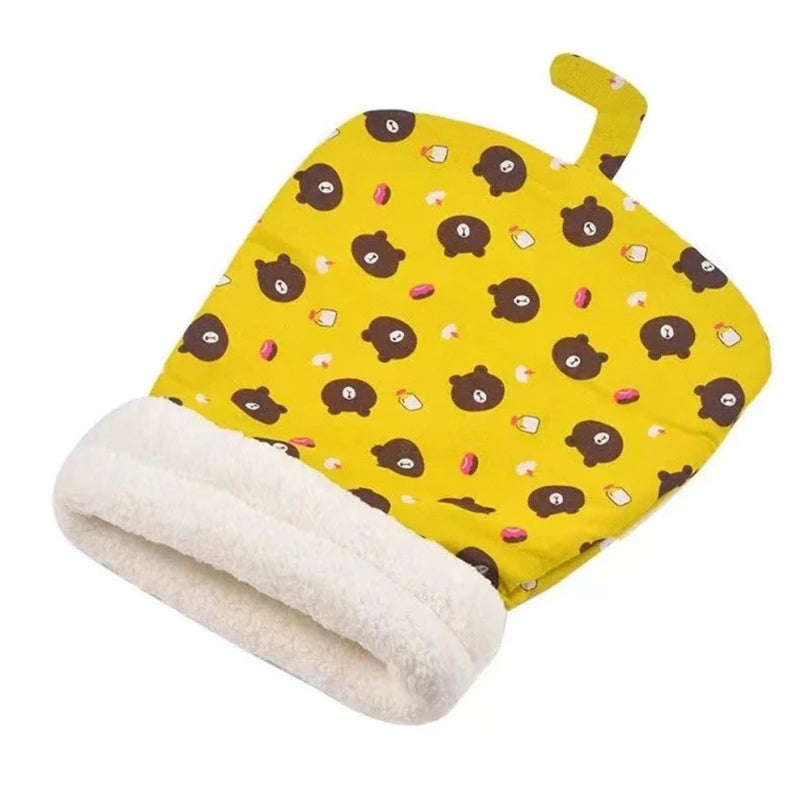 Cat sleeping bag in yellow with bear patterns, plush interior for winter comfort.